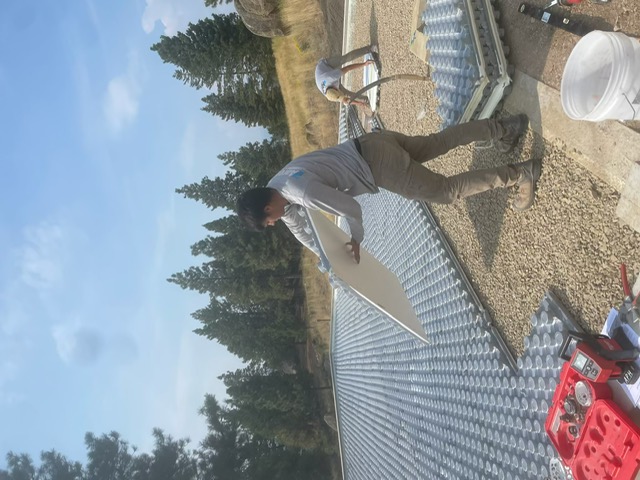 Aaron's Plumbing technician installing radiant floor heating on a Montana home build